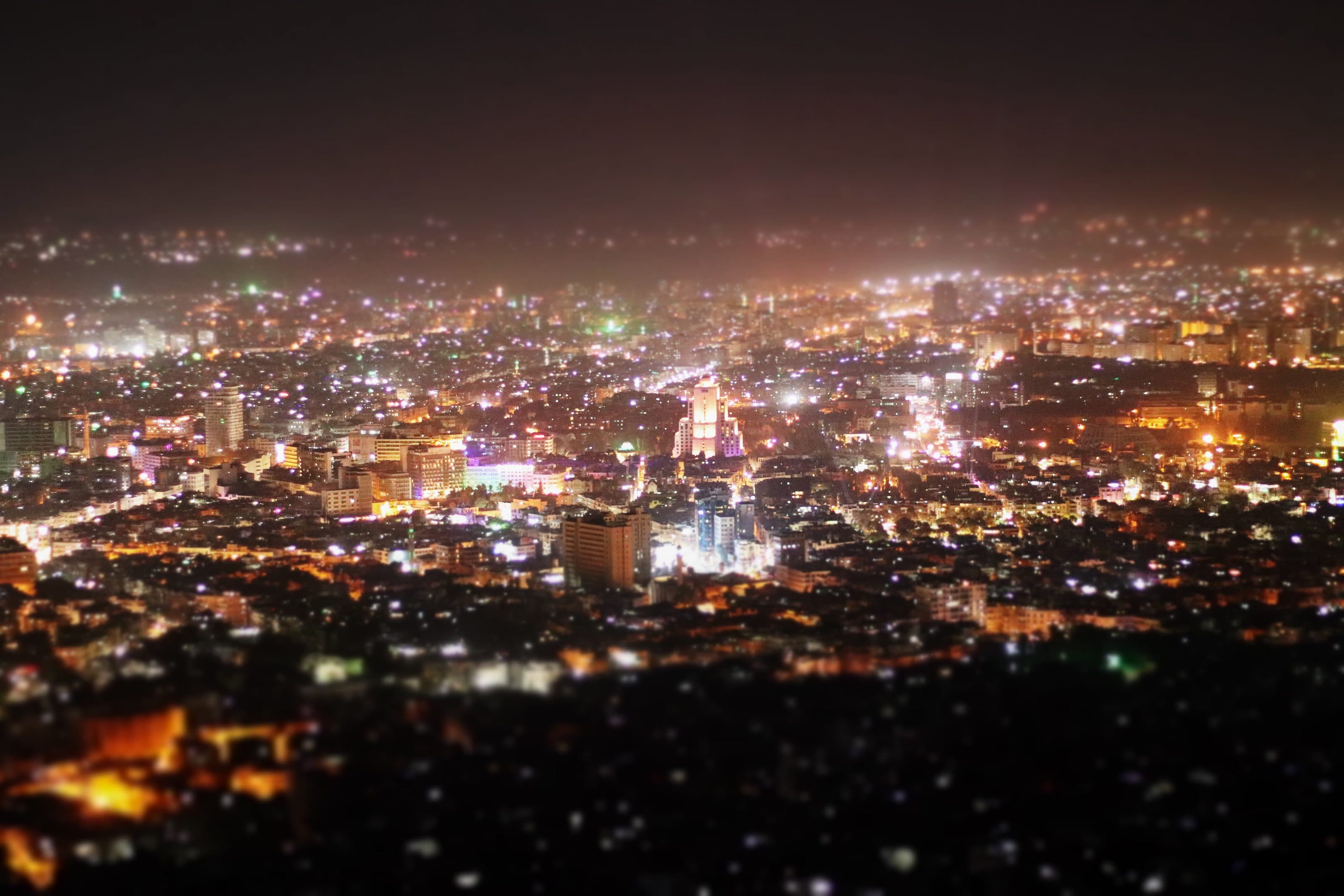 Damascus at night, seen from Mount Qasioun, the city lights spreading to the horizon